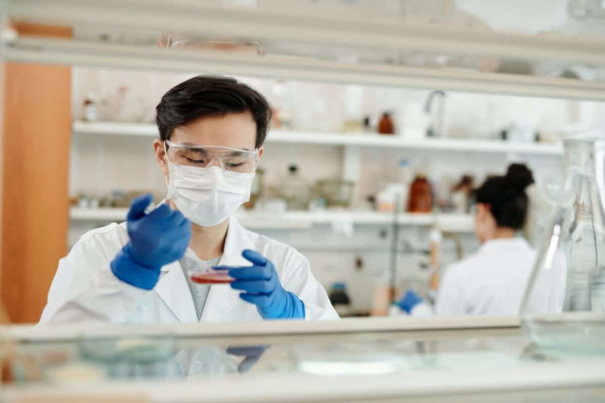 doctor in a lab testing cancer screening samples