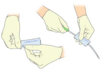 hands opening a lubricant packet and coating the length of a catheter