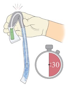 hand popping the water sachet and waiting 30 seconds to fully activate the coating of a catheter