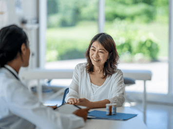 woman consulting her doctor about bladder sling surgery